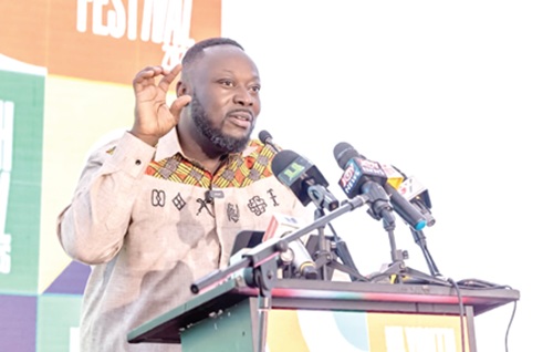 George Opare Addo (left), Minister of Youth Development and Empowerment,  addressing the gathering