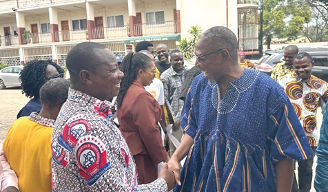 Dr Clement Apaak (right) in a handshake with a member of the Ghana National Association of Private Schools