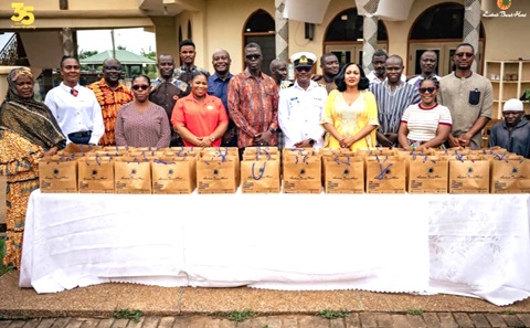 Ekua Zara Ghartey-Tsagli (2nd from right), Head of Marketing, Labadi Beach Hotel, and Lt Mohammed Bisbao Said (3rd from right), Assistant Director of Religious Affairs at the Ghana Navy Headquarters, with staff of the hotel and some worshippers at the Al Aziz Central Mosque