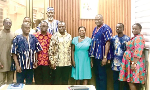Franklin Sowa (3rd from right), Director, Marketing and Sales, GCGL, and William Kartey (4th from left), Chief Director, Ministry of Transport, along with delegates from Graphic Communications Group Ltd and some Executives of the Ministry of Transport.  Picture: ESTHER ADJORKOR ADJEI