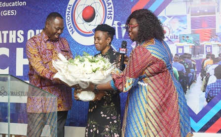 Dr Kwaku Mensa-Bonsu (left), Founder, Primetime Limited, with Nana Akua Mensa-Bonsu (right), Managing Director, Primetime Limited, presenting a bouquet to Prof. Elsie Effah Kaufman (middle), NSMQ quizmistress.  Picture: BENEDICT OBUOBI