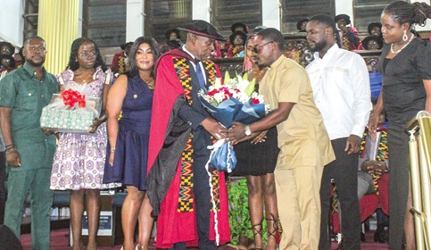 Prof. Samuel Ardey Codjoe (4th from left), Pro-Vice-Chancellor, Research, Innovation and Development, UG, receiving a gift from his family. Picture: ERNEST KODZI