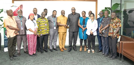 Simon Madjie (arrowed), CEO of GIPA, and Clement Boateng  (6th from left), GUTA President, with GUTA executive and staff of GIPA