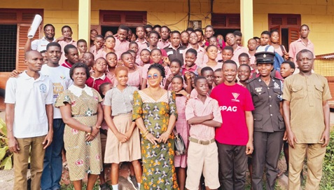Stakeholders of Essential Services Package with the pupils of Elmina M/A Basic School after an engagement on Sexual Reproductive Health