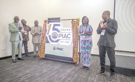 From left: Isaac Adongo, Chairman, Finance Committee of Parliament; Richard Ellimah, Chairman, PIAC; Edward Yaw Afriyie, Chairman, Anniversary Planning Committee; Prof. Akosua Keseboa Darkwah, Chairperson for the occasion, and Prof. Francis Dodoo (right), Guest Speaker, applauding after unveiling the 15th anniversary logo. Picture: DOUGLAS ANANE-FRIMPONG