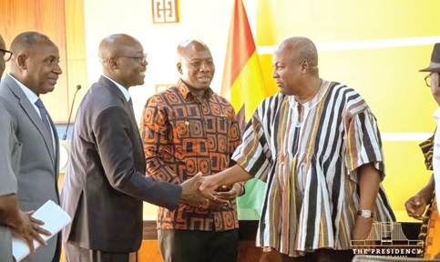 President John Dramani Mahama (right) exchanging pleasantries with Dr Cassiel Ato Forson (left), Minister of Finance and committee Chair