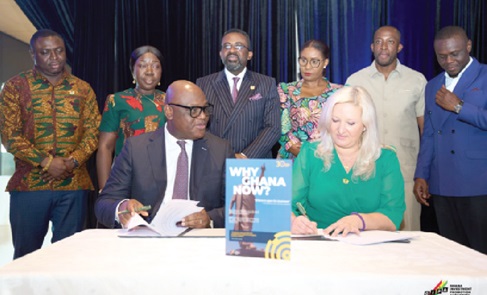 Simon Madjie (seated left), CEO of GIPA, and Ramona Tarta (seated right), OBG Regional Director for West Africa, with Dr Johnson Asiama (standing 3rd from left), Governor of Bank of Ghana; Elizabeth Ofosu-Adjare (standing 2nd from left), Minister of Trade, Industry and Agribusiness, and other senior executives of state agencies