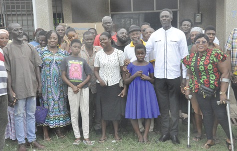 Stephen Addo (2nd from right), Ho MCE, and some of the PWDs and their caregivers