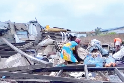 Some of the affected persons sifting through the rubble to salvage what was left of their belongings