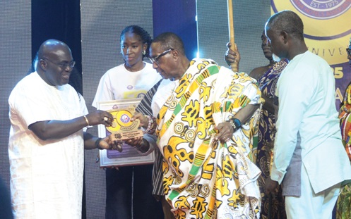 Nene Nagai Kassa VIII (right), Chief of Agomeda, Shai Traditional Area, receiving his award from Julius Debrah