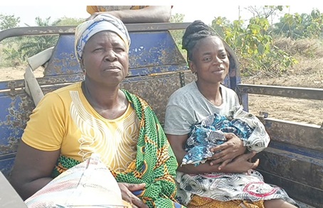Cynthia Ndoonbi (right) on her way to the hospital after delivering the twins Cynthia Ndoonbi (right) on her way to the hospital after delivering the twins