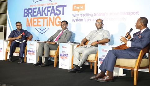 Eric Tetteh Addison (right), Director, Policy and Planning, Ministry of Transport, making his submissions during the panel discussion at the Graphic Business/Stanbic Bank Breakfast Meeting. Also on the panel is Prof. Sam Enoch (2nd from right), Associate Professor, University of Education, Winneba; Isaac Simpson (2nd from left), Head of Financial Advisory and Equity Capital Markets, Stanbic Bank, and Winston Tackie (left), moderator of the panel. Picture: BENEDICT OBUOBI
