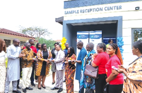 Dr Fiona Braka (4th from left), WHO Representative in Ghana, handing over the keys to the Sample Reception Centre to Professor Alfred Edwin Yawson, Provost, College of Health Sciences