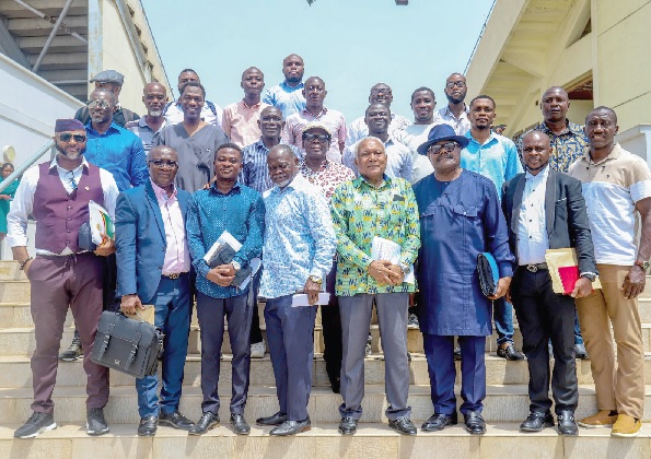 •Samir Captan (4th from right, front row), GBIMC Chairman, and committee members with Yaw Ampofo Ankrah, NSA Director-General