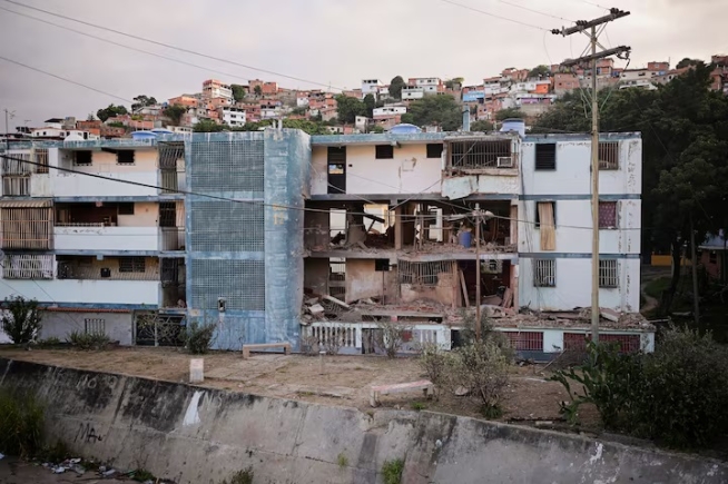 A damaged building following U.S. strikes on Venezuela, during which President Nicolas Maduro and his wife, Cilia Flores, were captured, in Catia La Mar, Venezuela, January 4, 2026. REUTERS/Gaby Oraa