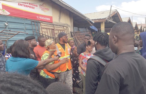 Phyllis Naa Koryoo Okunor (arrowed), Member of Parliament for Awutu Senya East, in a chat with some of the traders after the incident Phyllis Naa Koryoo Okunor (arrowed), Member of Parliament for Awutu Senya East, in a chat with some of the traders after the incident