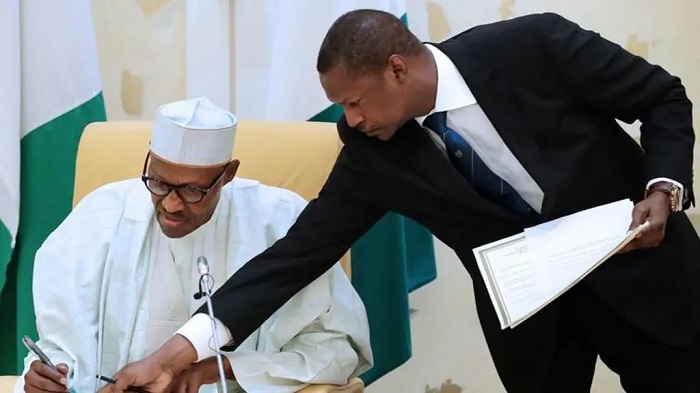 Abubakar Malami (right), who is married to the daughter of former President Muhammadu Buhari (left), was widely seen as the most influential minister in the last government