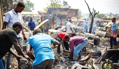 Some mechanics trying to salvage some items after the fire was brought under control. Some mechanics trying to salvage some items after the fire was brought under control.