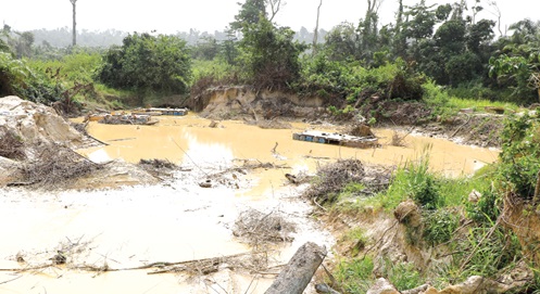 A section of the Oda River Forest Reserve reduced to a gapping pit by illegal miners. A section of the Oda River Forest Reserve reduced to a gapping pit by illegal miners.