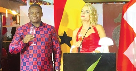 Samuel Nartey George (left) with Simone Giger proposing  a toast at the 735th National Day celebration programme