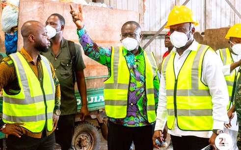 Joseph Siaw Agyepong (2nd from right),  Executive Chairman, Jospong Group, briefing Ahmed Ibrahim (right), Minister of Local Government, Chieftaincy and Religious Affairs, on the operations of the station