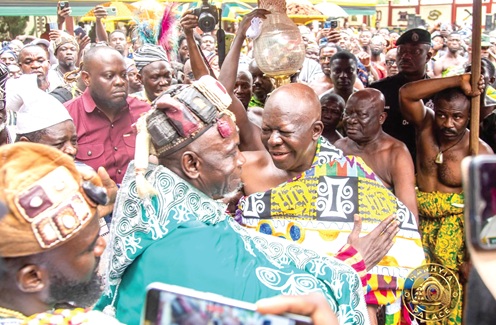 Otumfuo Osei Tutu II (right) welcoming Bii-Kunuto Jewu Soale I, the Yagbonwura, at the durbar grounds at Manhyia