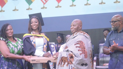 Daniella Quansah (2nd from left) receiving the Overall Best Student Award from Nana Kwaku Dei I (2nd from right), Development Chief of Pakro in the Eastern Region. With them are Dr Daniel McKorley (right), CEO of McDan Group, and Camilla A. Fynn-Aquah (left), a member of the board of Wisconsin International University College. Picture: ESTHER ADJORKOR ADJEI