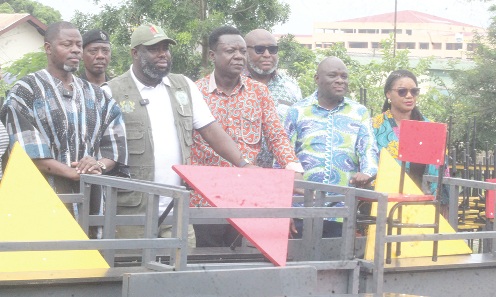 Michael Kpakpo Allotey (2nd from left), Mayor of Accra presenting the desks to some beneficiaries. Picture: ESTHER ADJORKOR ADJEI 