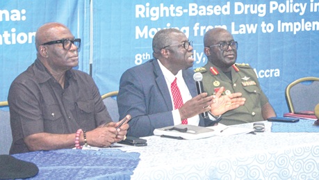 Sir Dominic Adjei, Supreme Court Justice, addressing the meeting. He is flanked by Major General Maxwell Obuba Mantey (right), Director-General, NACOC, and Ebenezer Okletey Terlabi (left), Deputy Minister for the Interior. Picture: ERNEST KODZI
