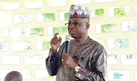 Ali Adolf John (right), Northern Regional Minister, addressing participants in the meeting