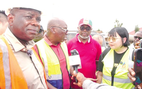 Mallam Issah Ishak (2nd from left), Chief Executive of the GHA, addressing Olivia Guo (right), the Commercial Director of Greenhouse Development International, when he intervened after concerns raised by Kwame Governs Agbodza (left), Minister of Roads and Highways
