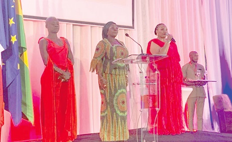 Diarra Dimé-Labille (left), French Ambassador to Ghana, with  Abla Dzifa Gomashie (middle), Minister of Tourism, Culture and Creative Arts, as they pay compliment to the national anthem of both countries.