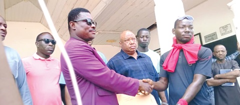 Albert Dok Dong (right), one of the convenors of the demonstration, presenting the petition to Francis Yenwona Tobig (left), the Nabdam District Chief Executive (DCE), while others look on. Albert Dok Dong (right), one of the convenors of the demonstration, presenting the petition to Francis Yenwona Tobig (left), the Nabdam District Chief Executive (DCE), while others look on.