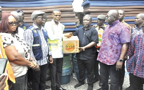 James Gunu (3rd from right), the Volta Regional Minister, receiving the items from Paschal Agbagba, the Volta Regional Director of NADMO, while some DCEs look on James Gunu (3rd from right), the Volta Regional Minister, receiving the items from Paschal Agbagba, the Volta Regional Director of NADMO, while some DCEs look on