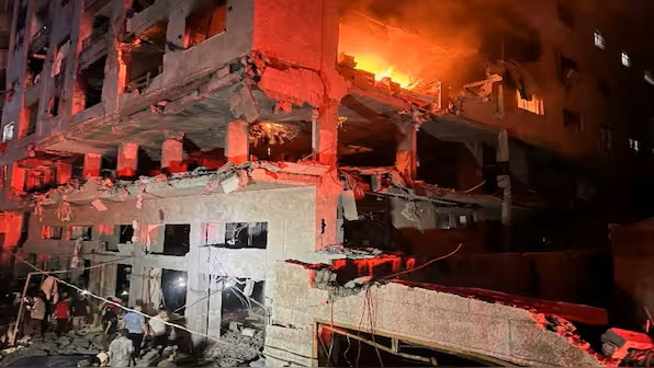 A fire erupts in a residential apartment after Israeli shelling, according to the Ministry of Health, in Gaza City on Friday. Reuters