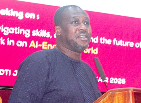 Some students applauding at the job fair. INSET: Dr David King Boison, CEO, Knowledge Web Centre, addressing students at the Job and Opportunity fair