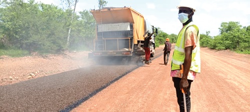 The return of heavy construction equipment and workers to the road has renewed hope among residents