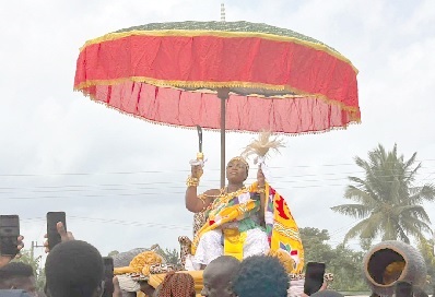 Nana Aba Kum I, the Mpuntuhemaa of Badukrom/Kokwado in the Ajumako Enyan Essiam District in the Central Region, being carried on a palanquin