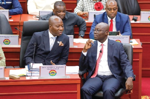 Mahama Ayariga (left), Majority Leader, interacting with Dr Cassiel Ato Forson, Minister of Finance, after his presentation. Picture: ELVIS NII NOI DOWUONA 