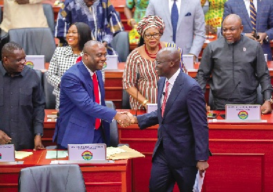 Thomas Nyarko Ampem (2nd from right), Deputy Minister of Finance, congratulating Dr Cassiel Ato Forson (right), Minister of Finance, after his presentation. Picture: ELVIS NII NOI DOWUONA 