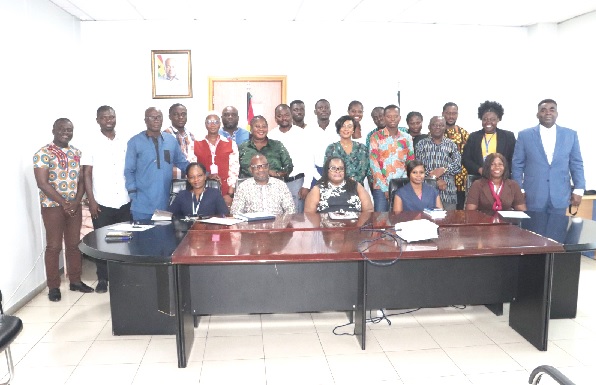 Dr Bernice Welbeck (seated middle), Executive Secretary, National Labour Commission, and Samuel Agbey (seated 2nd from left), Head, Industrial Relations; Comfort Gyimah-Botchway (seated 2nd from right), Head of Finance, with the press corps after the workshop