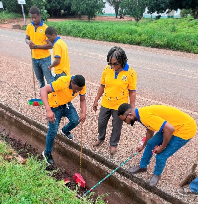 Some members of the team clearing a drain during the clean-up exercise