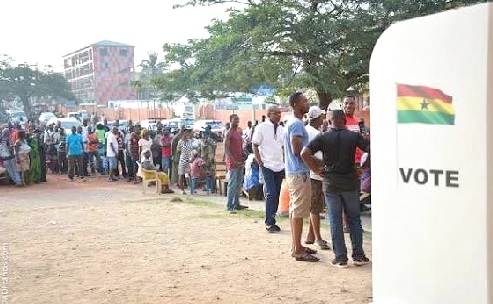 Somes voters in a  queue waiting to cast their ballot