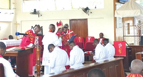 Rt Rev. Dr George Kotei Neequaye, Bishop of the Tema Diocese of the Anglican Church, administering canonical oaths to the newly ordained ministers