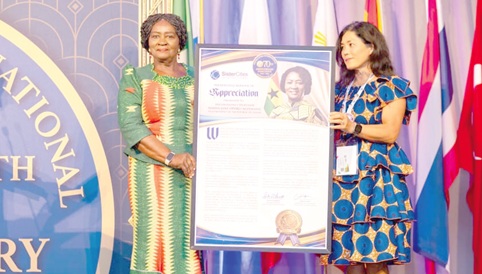 Vice-President Prof. Naana Jane Opoku-Agyemang receiving a citation from Dr Ricki Garrett, President and CEO of Sister Cities International