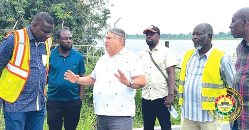 Avi Ashkenazi (3rd from left), Project Manager of Lesico, explaining a point to Maxwell Lukutor (left), MP, South Tongu, and his entourage