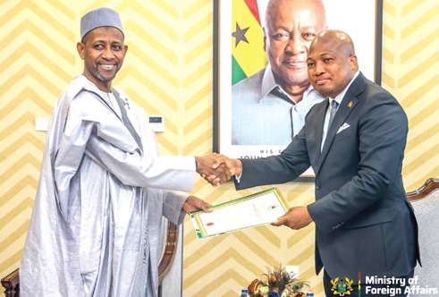 Samuel Okudzeto Ablakwa (right), the Minister of Foreign Affairs, receiving the letter of credence from Shehu Ilu Barde, the designated Nigerian High Commissioner to Ghana