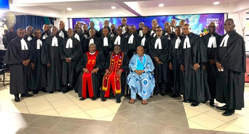 Rt. Rev. Prosper Samuel Dzomeku (seated middle),Yohanes Kwasi Ahiabu (seated left), Synod Clerk, and Eyram Kwame Atsu (seated right), the Male Presbyter, with the 33 ordained reverend ministers