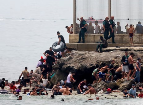 Spainish enclave Ceuta raises alarm as thousands cross border from Morocco