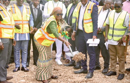 Suweibatu Adams, Chief Director of MESTI, cutting the sod for commencement of work on the 48-unit residential apartments for staff of GAEC